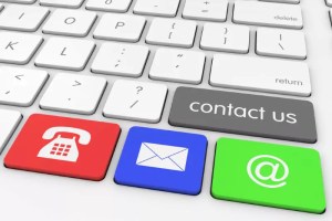 Contact form photo showing keyboard with keys of a red phone, blue letter and green @ symbol.